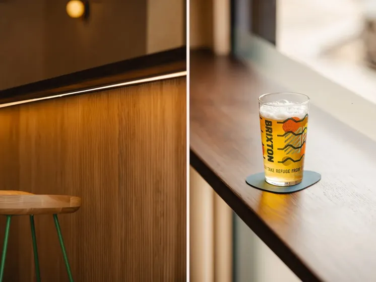 Left: Artistic photo of bar lighting and stool. Right: Brixton Brewery beer on worktop